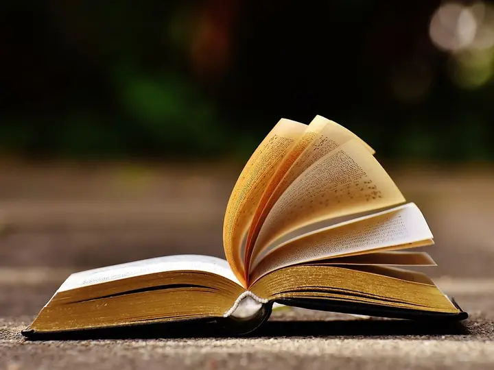 Open scientific book representing veterinary evidence and research